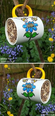 two pictures of the same bird feeder hanging from a tree branch with bees and flowers painted on it