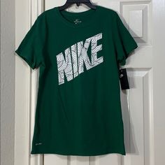 Nike Woman’s T-Shirt Size - M Style - Cu2828-341 Color - George Green *** Brand New New To Poshmark? Use Code @Iceskatingmom To Get $10 Off Your First Purchase!!! Nike Green Graphic Print T-shirt, Nike Green Sports T-shirt, Green Short Sleeve Shirt With Logo Print, Nike Green Graphic Tee, Nike Green Short Sleeve T-shirt, Green Nike Crew Neck T-shirt, Green Sports Tops With Logo Print, Graphic Tee Sports Shirt In Green, Green Sporty Top With Screen Print