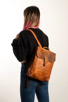 This backpack is produced in our workshop and it's %100 handmade. The handcrafted goods you use are produced from %100 authentic calf leather for you with specific care. Calf Leather can have a wrinkled, veined and pored appearance due to its natural features. There might be some changes in the color tone and texture details of the leather depending on the utilization. You can use this bag for a long time with this material. We wish you enjoy with it! Vintage Leather Backpack For Daily Use, Vintage Backpack With Leather Lining For Everyday Use, Leather Backpack With Waxed Finish For On-the-go, Vintage Everyday Backpack With Leather Backing, Everyday Leather Backpack With Waxed Finish, Leather Backpack With Waxed Finish, Vintage Leather Backpack With Waxed Finish For Everyday Use, Vintage Waxed Leather Backpack For Everyday Use, Vintage Leather Backpack With Waxed Finish