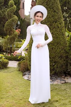 Traditional collar Fabric: Crepe, lace, beading Long sleeves Type: Modern ao dai Elegant Ao Dai With Lace Sleeves For Wedding, Fitted Wedding Gown With Embroidered Sleeves, Fitted Dress With Embroidered Sleeves For Wedding, Elegant Wedding Gown With Embroidered Sleeves, Traditional White Ao Dai For Party, Elegant Wedding Ao Dai With Lace Sleeves, Fitted White Ao Dai For Ceremonies, Wedding Lace Dress With Sheer Sleeves, Fitted Ao Dai With Intricate Embroidery For Ceremony