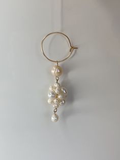 An adorable hoop earring featuring delicate freshwater pearls suspended in dangling cluster SOLD INDIVIDUALLY length: Please allow for slight variations due to the unique nature of the materials used. Unique Nature, Fresh Water, Freshwater Pearls, Jewelry Design, Hoop Earrings, Drop Earrings, Nature