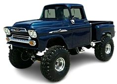 a large blue truck with big tires on it