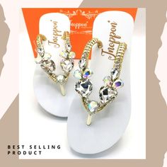 "Step into elegance with these stunning crystal embellished sandals. Designed to sparkle, each pair features intricately placed sparkling crystals on a comfortable yet chic base. Perfect for adding a touch of sophistication to any outfit, these sandals are perfect for a special occasion or simply to elevate your everyday look. Combining sophistication and comfort, you'll feel as fabulous as you look." Product Description: -  Quality Rubber Sole Thailand - Luxury Rhinestones  - 1.5 cm Sole Height Elegant Rhinestone Flip Flops For Summer, White Synthetic Sandals With Rhinestones, White Wedding Sandals, Cheap Rhinestone Beach Flip Flops, Elegant Rhinestone Wedding Flip Flops, White Sandals Wedding, Thailand Luxury, Evening Sandals With Rhinestones, Synthetic, Embellished Sandals