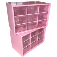 a pink shelf with lots of clear drawers