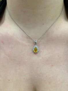 "14k white gold Pear shape/ Tear Drop Yellow Sapphire with Diamond Halo Pendant.  Material: 14k Solid white gold.  Center Stone: Natural Pear Yellow Sapphire.  Yellow Sapphire Weight: 2.06 Carats. Diamonds: 0.83 carats. Diamond Quality: VS2-SI1. Length: Top of the bail to the bottom approximately 1\". Actual Halo Stud is a little over .50 inches. Comes in a nice box.  Chain Included, select 16, 18, or 20\" at check out." Silver Jewelry With Brilliant Cut Pear Shape, Silver Pear-shaped Jewelry With Brilliant Cut, Pear-shaped Diamond Cut Jewelry In Diamond White, Pear-shaped Diamond White Jewelry With Diamond Cut, Platinum Necklaces With Diamond Accents, Pear-shaped, Dazzling Pear-shaped White Gold Necklace, White Gold Pear-shaped Necklace For Formal Occasions, Dazzling White Gold Pear-shaped Necklace, Pear-shaped White Gold Necklace For Formal Occasions