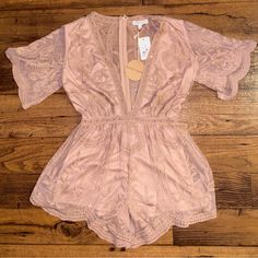 Honey Punch Boho Medium Pink Floral Lace Embroidery Romper New W/Tags. Details: 1.) Breast: 38” Inches 2.) Shoulder To Shoulder: 15” Inches 3.) Waist: 28” Inches 4.) Inseam: 3” Inches (Shorts) 5.) Thigh: 24” In. 6.) Hip: 38” In. 7.) Sleeve Length: 17” In. 8.) Zipper For Closure 9.) Extra Polyester Fabric 10.) Hand Wash 11.) Shell: 100% Polyester & Lining: 100% Polyester 12.) Size Medium Thanks For Looking And Please Look At My Listings For More Women Clothes! Festive Embroidered Fitted Jumpsuits And Rompers, Fitted Embroidered Jumpsuit For Festive Occasions, Embroidered Fitted Jumpsuits And Rompers For Festive Occasions, Spring Embroidered Lace Set, Honey Punch, Lace Embroidery, Women Clothes, Floral Lace, Jumpsuits For Women