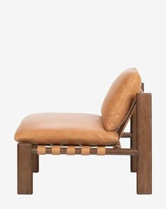 a tan leather chaise lounge chair with wooden frame and backrest, viewed from the side