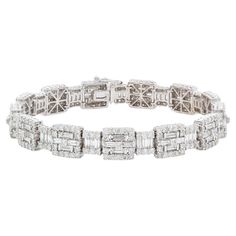 We are pleased to present this stunning White Gold Diamond Contemporary Baguette Diamond Tennis Line Bracelet. It features an estimated 8.40ctw G-H/VS-SI baguette & round brilliant cut diamonds all securely set in this breathtaking 18k white gold contemporary geometric bracelet with push button and safety clasp. The bracelet will fit a wrist up to 7.25". It is in excellent condition with very few signs of wear. This is a truly stunning piece with lots of fire and sparkle! Please feel free to mes Geometric Bracelet, Modern Bracelets, Baguette Diamond, Diamond Bracelets, Round Brilliant Cut Diamond, Push Button, White Gold Diamonds, Round Brilliant, Diamond White