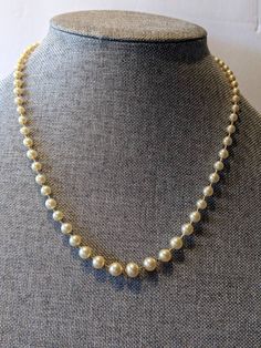 "Signed Faux Champagne 8mm Pearl Choker Necklace Single Strand Sterling Clasp High quality faux champagne pearl necklace with silk cording and hand knotted between pearls. Sterling silver push in clasp. Necklace will arrive gift boxed. * HALLMARKS Clasp is marked Sterling with a makers mark which I couldn't identify. * SIZE/MEASUREMENTS 22\" long with 8mm pearls * CONDITION In very good to excellent condition. Please use all the pictures as part of item's description. * MATERIALS Sterling Silver Classic Evening Pearl Necklace With Round Beads, Classic Pearl Necklace For Evening, Classic Beaded Pearl Necklace For Evening, Evening Pearl Necklace With Round Beads, Classic Single Strand Pearl Necklace For Evening, Formal Single Strand Pearl Beaded Necklace, Classic Adjustable Pearl Necklace For Party, Classic Gold Pearl Necklace With 8mm Beads, Adjustable Pearl Chain Necklace For Formal Occasions