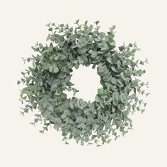 a wreath with green leaves is shown against a white background and looks like it could be used as an ornament