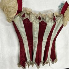 the back of a corset with red and white stripes