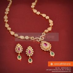 Wear this engrossing gold necklace set with vibrant stones and add to your beauty.