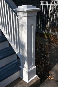 a white railing on the side of a house