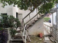 an old set of stairs leading up to a house