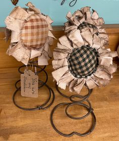 two decorative items sitting on top of a wooden table