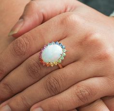 Ethiopian opal cabochon rainbow sapphire ring gold | Natural oval cut ethiopian opal rainbow ring gold | Big rainbow sapphire ethiopian opal GEMSTONE DETAILS : ✦ Gemstone : Ethiopian Opal ✦ Gemstone Type : Natural ✦ Gemstone Size : 10x14 MM ✦ Gemstone Shape : Oval Cabochon  ✦ Number of Gemstones : 1  ✦ Gemstone Weight : 5.100 Carats ✦ Gemstone Grade : AAA GEMSTONE DETAILS : ✦ Gemstone : Rainbow Sapphire ✦ Gemstone Type : Natural ✦ Gemstone Size : 2.60 MM ✦ Gemstone Shape : Round  ✦ Gemstone Weig Oval Ethiopian Opal Moonstone Ring, Multicolor Oval Cabochon Opal Ring, Multicolor Opal Gemstone Ring, Sapphire Ring Gold, Rainbow Ring, Gold Sapphire Ring, Rainbow Sapphires, Rainbow Rings, Rainbow Bracelet