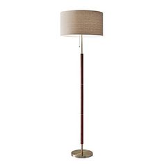 a floor lamp with a beige shade on the base and a light brown shade on the top