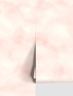 an abstract pink and white background with a corner in the middle