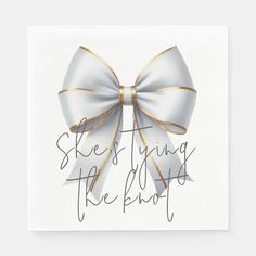 a white and gold bow with the words she's giving the blob