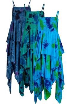 Loads of beautiful soft and floaty material in vibrant tie dye colours, double layer skirt, waterfall dipped hem style, fully shirred bodice, tie straps, 100% viscose Plus size - chest 42 - 52 inches, approx 50 inches from top of bodice to bottom dip (approx fit 18 - 26) Each dress is handmade and unique, the pattern placement may vary from the photos shown Love the pixie dress style? This tie dye handkerchief hem dress takes the well-loved pixie look to a fresh new level thanks to glorious colours. Think oceans, seas and sparking waters and you get the picture. Choose from deep grey with cool purple accents, dark green depths with dramatic blue and black, or exotic turquoise with vivid blue and green. Made from lush 100% viscose, it features a soft, floaty double layer waterfall skirt, a Bohemian Skirted Dresses For Festivals, Bohemian Festival Dresses With Handkerchief Hem, Bohemian Dress With Handkerchief Hem For Festivals, Blue Bohemian Skirted Dress, Bohemian Blue Skirted Dress, Bohemian Blue Dress With Handkerchief Hem, Witchy Dresses, Double Layer Skirt, Pixie Outfit