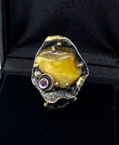 Artisan Baltic Amber RingHand-made Sterling Silver, 24k Gold, size 12Stones used: Baltic Amber, AmethystFace of the ring:  Height – 40mm, Width-30mm                                       Height – 1 1/2”, Width-1 1/4”                            Band height - 8mmUnique Handcrafted One-of a-kind Design RingEach Piece of Jewelry in my Collection is Absolutely One of a Kind!When you start wearing a piece of my jewelry you will fall in love with it more and more each day and feel that good Energy and Luxury Polished Opal Ring For Gift, Unique Polished Gemstones For Formal Occasions, Unique Formal Polished Gemstones, Unique Formal Gemstones With Polished Finish, Unique Oval Gold Gemstones, Luxury Yellow Rings For Collectors, Artisan Rings With Polished Finish For Formal Occasions, Artisan Rings With Polished Finish For Formal Events, Gold Jewelry With Stone Setting For Collectors