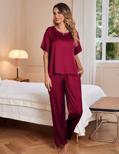 This luxurious pajama set is crafted from Silk Satin fabric for a soft and comfortable feel. Featuring a short sleeve top and long pants with an elastic waist, this set is perfect for lounging around in style. Enjoy the silky smooth fabric that offers breathability and a perfect fit. A lightweight two-piece pajama set featuring a pullover tee top and long pants. Soft satin silky fabric, comfy to wear. Top: Loose fit, satin short sleeve t-shirt. Solid color, crewneck, and a chest pocket casual ni Solid Color Relaxed Fit Pant Set For Loungewear, Relaxed Fit Lounge Pant Set, Comfortable Solid Short Sleeve Sets, Comfortable Solid Color Short Sleeve Sets, Casual Short Sleeve Tops For Night, Relaxed Fit Short Sleeve Pant Set For Loungewear, Solid Color Short Sleeve Sleepwear For Pajama Party, Solid Color Short Sleeve Lounging Sets, Red Short Sleeve Sets For Pajama Party