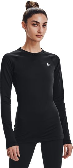 Build up your protection against the cold starting with the Under Armour Authentics Long-Sleeve Crew-Neck Shirt for Ladies as your sleek, warm base layer of choice. Dual-layer 87% polyester/13% elastane fabric boasts a smooth, fast-drying exterior and ultra-warm, brushed interior for workout and wind-down versatility. The shirt efficiently wicks away perspiration and features odor-fighting technology to prevent the growth of odor-causing microbes. UA Authentics women's long-sleeve crew-neck shir Long Sleeve Gym Tops, Athletic Tops Women, Sweat Top, Gym Tops, Under Armour Women, Crew Neck Shirt, Crew Sweatshirts, Black & White, Heather Black