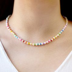 💟Introducing our exquisite Natural Freshwater Pearl Necklace, a stunning piece of jewelry that effortlessly combines the elegance of freshwater pearls with vibrant rainbow beads. This necklace is perfect for any occasion, whether it's a birthday, wedding, or a heartfelt Mother's Day gift for that special someone in your life. Crafted with utmost care, this necklace is designed to make a statement and add a touch of sophistication to any outfit. 💟1. Combination of Natural Freshwater Pearls and Rainbow Single Strand Beaded Necklace As Gift, Gift Pearl Necklace With Colorful Beads, Rainbow Pearl Jewelry With Pearl Charm, Rainbow Pearl Charm Jewelry, Rainbow Dainty Jewelry With Round Beads, Rainbow Round Beads Dainty Jewelry, Multicolor Tiny Beads Jewelry For Birthday, Dainty Rainbow Round Bead Jewelry, Dainty Rainbow Round Beaded Jewelry