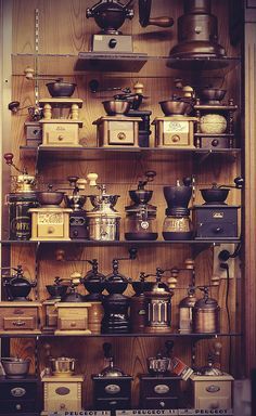 the shelves are filled with different types of pots and pans