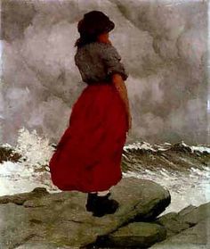 a woman in a red dress standing on rocks