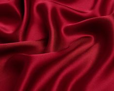 "The item is satin fabric(silk satin, silk stretch satin) of NO.13 purplish red color. If you are a professional buyer, please buy our fabric color card directly, so that the color difference between the photo color and the fabric color can be minimized. ●90 Colors Card. https://etsy.me/2OsRK8N ●Silk Fabric Sample. https://etsy.me/2KlMDXG WE COMBINE SHIPPING - Please Contact Us For Custom Order For silk satin we have 16mm, 19mm and 30mm: ●16mm thickness is the preferred fabric for pajamas, silk Silk Colors Fabrics, Red Silk Aesthetic, Silk Material Fabrics, Red Fabric Aesthetic, Silk Texture Fabric, Red Silk Background, Red Fabric Texture, Silk Fabric Texture, Satin Fabric Texture