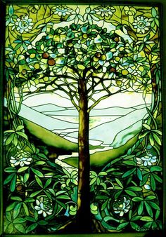 a stained glass window with a tree in the middle