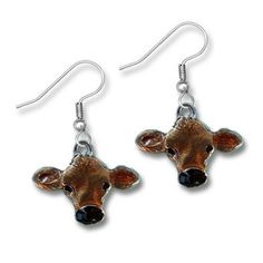 "These hand painted Jersey cow earrings are the delight of farmers young and old. As the artist, I do love cows. I have always created cow jewelry! And I love the way these have a translucent glow in the light. I think they are very pretty! Each cow earring is 5/8\" tall and 7/8\" wide. Don't forget to scroll through the photos and see the 2 matching necklaces I've created to go with the earrings! Sets are a lot of fun, and I love to offer that option. The original model for The Magic Zoo's uniq Cow Jewelry, Cow Earrings, Jersey Cow, Earrings Sets, Cow Gifts, Sterling Silver Charm Bracelet, Enamel Jewelry, Silver Pieces, Matching Necklaces