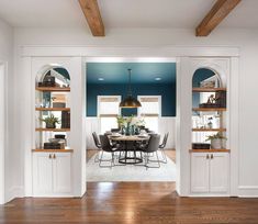 an instagramted photo of a dining room with open shelving