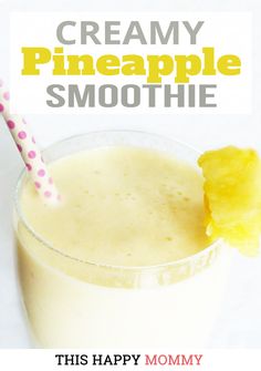 a smoothie in a glass with a pink and yellow straw