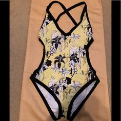 Calvin Klein Adorable 1pc. Criss Cross Open Back Swimsuit W/Bikini Style Bottom, This Has Been Washed But Never Worn. It Is A Size 10 But Runs Super Small, It Fits Like A Size 8. My Intention Was To Keep It And Lose A Little Weight And That Never Happened! The Colors Are Black, White, And Lemon Yellow, Excellent Condition. Yellow Stretch One-piece Beachwear, Yellow Lined Swimwear For The Beach, Yellow Lined Swimwear For Beach, Yellow Lined Swimwear For Vacation, Yellow Lined Swimwear For Summer, Yellow One Piece Swimwear For Beach, Yellow One-piece Beachwear For Swimming, Yellow Beachwear One Piece For Swimming, Summer Yellow One-piece With Lined Body