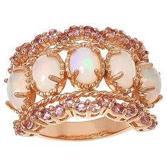 Colleen Lopez Opal and Pink Tourmaline Scalloped Wide Band Ring  This Colleen Lopez ring features stunning opals set on a wide band, plus pretty pink tourmaline stones along the scallop-edged design. Rose gold plating adds a touch of elegance to the already beautiful piece.       Approx. 5/8"L x 1"W x 3/16"H; shank 1/8"W     Stamped .925 sterling silver; rose gold plating   Stone Information       All sizes and weights approximate     White Opal - Oval (7x5mm)     Pink Tourmaline - Round; 1.12ct Famous Jewelry, Soft Life, Wide Band Ring, Color Bands, Tourmaline Stone, Wide Band Rings, Size 10 Rings, Gorgeous Jewelry, White Opal