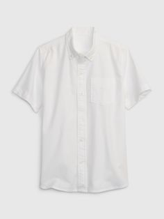 Made with 98% organically grown cotton.  Organic cotton is better for people and the environment because it's grown without the use of harmful synthetic pesticides and fertilizers.  Smooth woven oxford uniform shirt.   Spread collar, button front.   Short sleeves.   Patch pocket at chest. Oxford Uniform, Uniform Shirt, Uniform Pants, Uniform Shirts, School Uniforms, Gap Kids, Pesticides, Oxford Shirt, The Gap