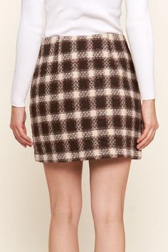 The Brushed Plaid Mini Skirt is a chic and versatile piece that adds a touch of sophistication to your wardrobe. Featuring a classic plaid pattern and brushed fabric, this skirt offers a timeless yet on-trend look. The mini length adds a flirty and playful touch, perfect for styling in various ways. Pair it with a sleek blouse for a polished office ensemble or dress it down with a cozy sweater for a casual day out. The soft fabric and comfortable fit make it easy to wear all day long. Stay styli Fall Plaid Mini Length Bottoms, Chic Plaid Pleated Skirt, Fall Plaid Lined Skort, Chic Plaid Mini Skirt Bottoms, Chic Plaid Relaxed Skirt, Chic Relaxed Plaid Skirt, Chic Plaid Skirt, Plaid Mini Skirt With Lining For Work, Plaid Lined Mini Skirt For Work