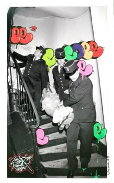 an old black and white photo of two people on the stairs with balloons in the air