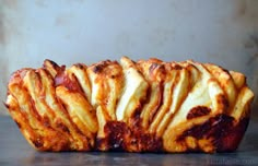 some kind of bread that looks like it has been sliced and is ready to be eaten