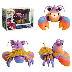 three different types of crab toys in front of a box and an action figure on the back