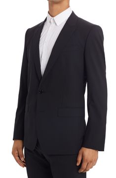 Italian craftsmanship shines through on this elegantly tailored stretch-wool suit cut in a classic fit and finished with meticulous pickstitching. Jacket has peaked lapels; chest welt pocket; front flap pockets; four-button cuffs Trousers have zip fly with button closure; slant pockets; back button-welt pockets Jacket is lined 98% wool, 2% spandex Dry clean Made in Italy Men's Designer Clothing Pocket Jacket, Wool Suit, Designer Clothes For Men, Flap Pocket, Martini, Suit Jacket, Dolce And Gabbana, Nordstrom, Trousers