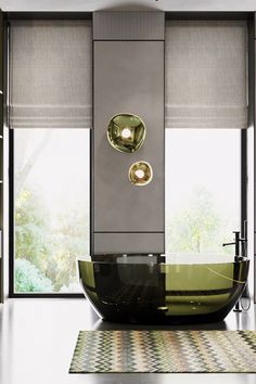 a modern bathroom with an oval glass sink