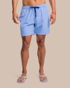 The front view of the Southern Tide Solid Swim Trunk 3 by Southern Tide - Ocean Channel Recycled Polyester Swim Trunks With Built-in Shorts For Beach, Relaxed Fit Nylon Swim Trunks With Side Pockets, Functional Blue Beach Shorts, Sports Swimwear With Pockets And 4-way Stretch, Functional Solid Swim Trunks With Built-in Shorts, Sport Swimwear With Pockets And 4-way Stretch, Casual Blue Swimwear For Travel, Sporty Solid Swim Trunks With Upf 50+, Swim Trunks With Elastic Waistband And 4-way Stretch