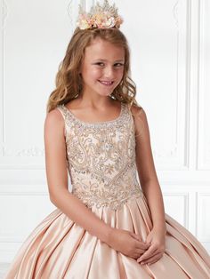 Your sweet girl will receive lots of compliments in this beaded long sleeveless dress with box pleated A-line skirt by Tiffany Princess 13591. Made out of satin, this beautiful ball gown features a scoop neck bodice adorned with sparkly beads, side pockets, partial open back, a floor length A-line pleated skirt, sweep train, and a lace-up corset back. House of Wu Tiffany Princess Collection Spring 2020 Style Number: 13591 Fabric: Satin Colors: Lilac, Light Rose, Red Wine Sizes: 2, 4, 6, 8, 10, 1 Princess Style Embellished Sleeveless Dresses, Princess Style Sleeveless Embellished Dresses, Embellished Sleeveless Dress For Pageant, Sleeveless Embellished Ball Gown For Formal Occasions, Embellished Fitted Sleeveless Ball Gown, Formal Embellished Sleeveless Ball Gown, Elegant Sleeveless Dress For Pageant, Princess Style Sleeveless Dress With Fitted Bodice, Elegant Sleeveless Dresses For Pageants