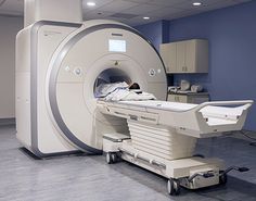 a hospital room with an mri machine in it