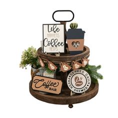 a wooden stand with coffee signs and other items on the top, including a potted plant