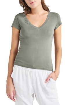 Achieve a casual-cool vibe in this soft cotton-blend T-shirt designed with a dipped neckline and abbreviated sleeves. 23 1/2" length (size Medium) V-neck Short sleeves 60% cotton, 40% rayon Machine wash, tumble dry Imported Summer Cotton V-neck Top, Casual Cotton V-neck Top For Summer, Casual Stretch V-neck Top With Short Sleeves, Fitted V-neck Top For Everyday, Casual Fitted T-shirt For Loungewear, Cotton Stretch V-neck Short Sleeve Top, Spring V-neck T-shirt For Casual Gatherings, Versatile V-neck T-shirt For Loungewear, Cotton V-neck Top For Summer