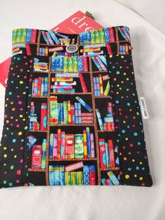 a book bag with colorful books on it